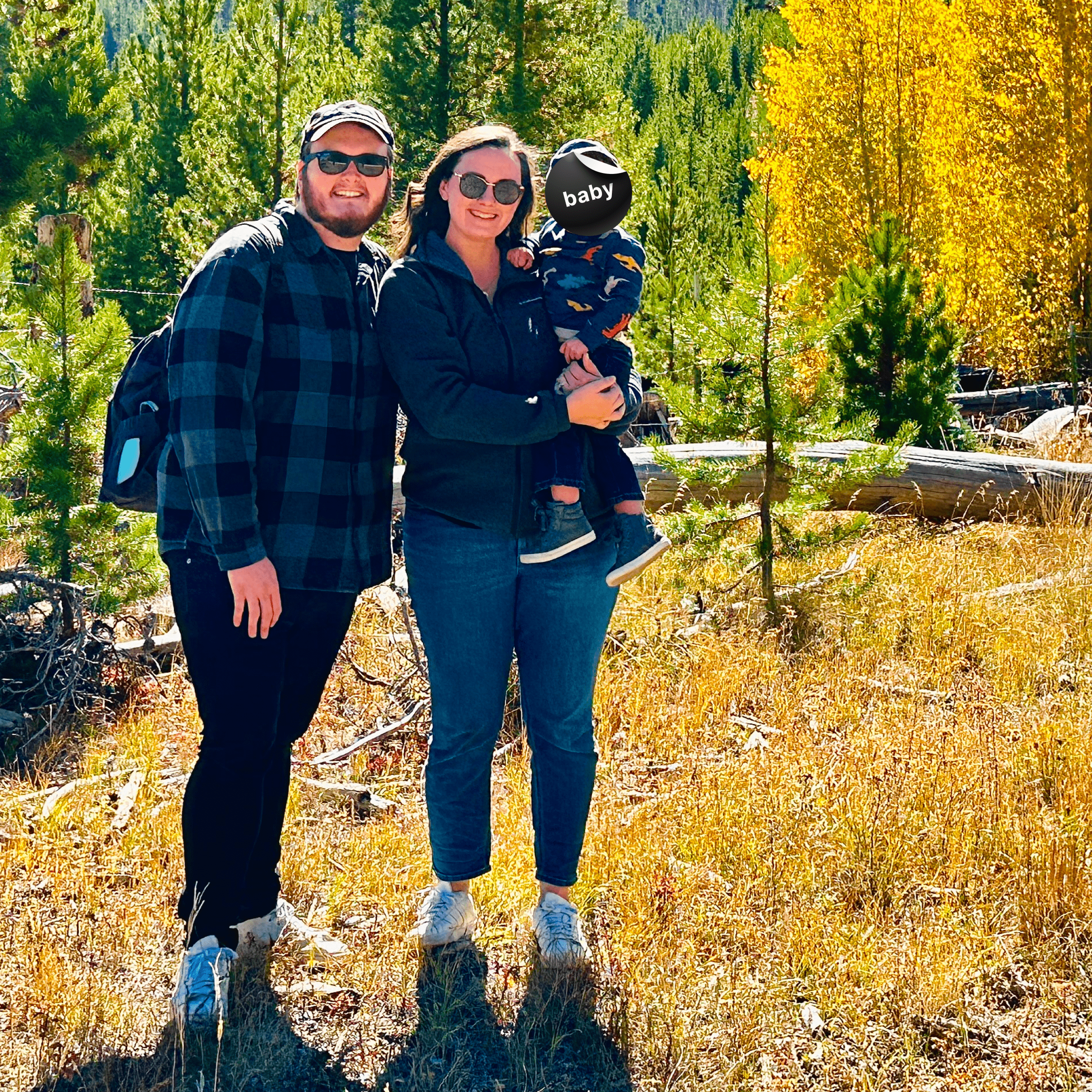 A cute family of my entire family in the mountains, surrounded by aspen trees.